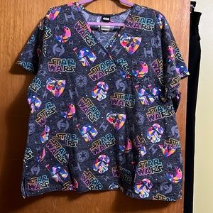 3X Star Wars Scrub Top. Super Colorful. Has 2 pockets in the front.